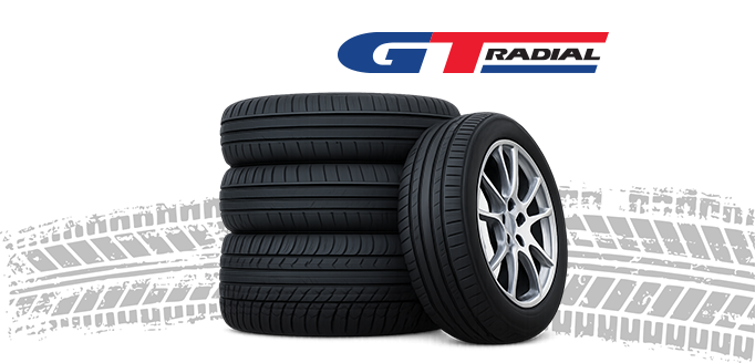 Stack of GT Radial passenger tyres with alloy wheel, featuring the GT Radial logo above and tyre tread design in the background.