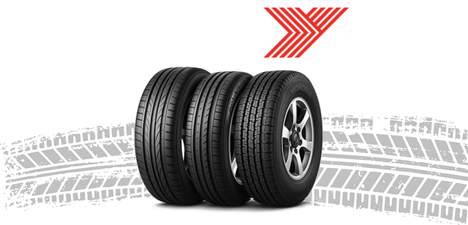 Three Yokohama tyres with tread patterns and logo on a white background